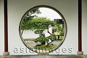 Asia Images Group - Bonsai trees seen through circular window at the Chinese Garden, Singapore
