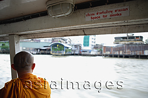 Asia Images Group - Buddhist monk on river boat taxi, Chao Praya River, Thailand