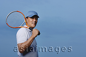 Asia Images Group - Man holding tennis racket, playing sports