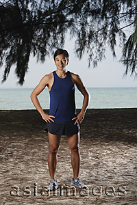Asia Images Group - Man standing by beach after running, workout
