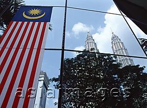 Asia Images Group - Petronas Towers reflected on the curtain wall of a commercial building, Kuala Lumpur, Malaysia
