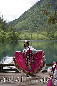 Asia Images Group - Woman in ethnic costume of Tibet, Xiongmaohai (Panda lake), Jiuzhaigou scenic Area, Wuhang, China