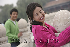 Asia Images Group - A couple smile as they hug