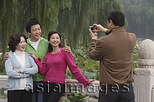 Asia Images Group - A family pose for photos together while on vacation
