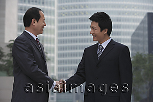 Asia Images Group - Two businessmen shake hands