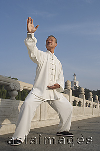 Asia Images Group - An old man practices Chinese martial arts