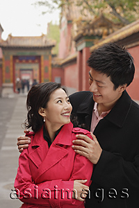 Asia Images Group - A couple with their arms around each other