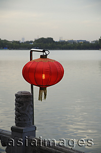 Asia Images Group - Chinese lanterns next to water
