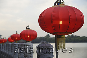 Asia Images Group - Chinese lanterns next to water
