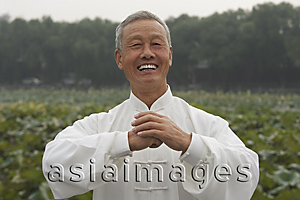 Asia Images Group - An old man smiles as he looks at the camera