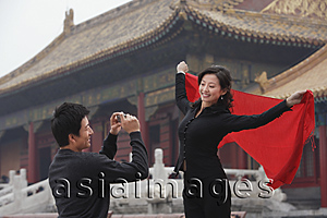 Asia Images Group - A couple take photos of each other in front of The Forbidden City, Beijing