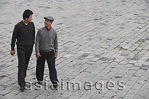 Asia Images Group - A grandfather and grandson walk together