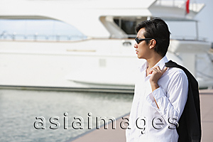 Asia Images Group - Man on pier, looking into distance