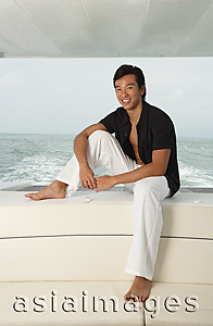 Asia Images Group - Man on yacht, smiling at camera