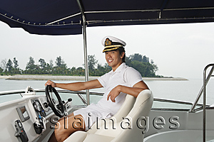 Asia Images Group - Man on yacht, smiling at camera