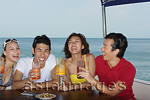 Asia Images Group - Young people on yacht having drinks