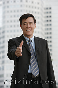Asia Images Group - Businessman reaching out hand for handshake