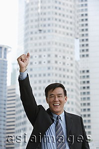 Asia Images Group - Businessman raising his arm and making a fist