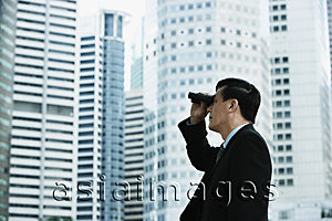 Asia Images Group - Businessman looking through binoculars