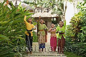 Asia Images Group - Balinese girls throwing flowers