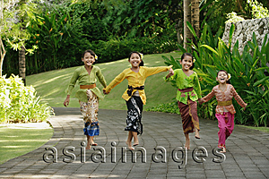Asia Images Group - Balinese girls laughing and running