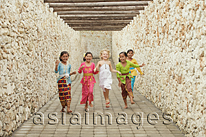 Asia Images Group - Balinese girls running with Caucasian girl