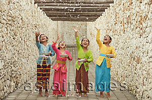 Asia Images Group - Balinese girls throwing flowers