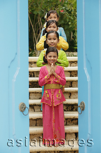 Asia Images Group - Balinese girls standing in row, looking at camera