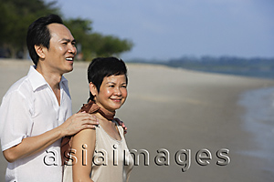 Asia Images Group - Mature couple at the beach, looking into distance
