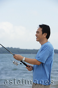 Asia Images Group - Man fishing in the sea