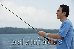Asia Images Group - Man fishing in the sea
