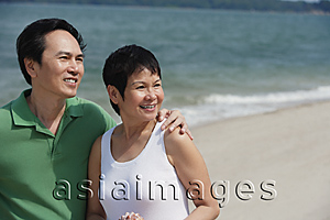 Asia Images Group - Mature couple at the beach looking into distance