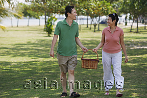 Asia Images Group - Mature couple in the park going for a picnic