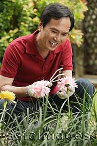 Asia Images Group - Man gardening