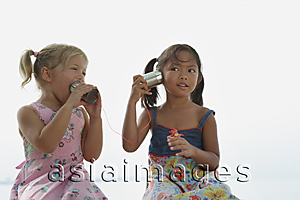 Asia Images Group - Girls playing with toy phones