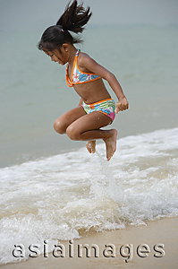 Asia Images Group - Girl jumping into sea