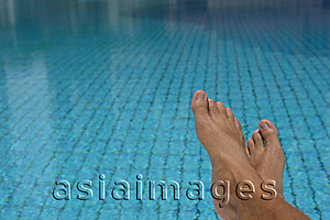 Asia Images Group - Feet at a swimming pool