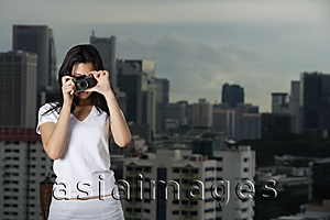 Asia Images Group - Young woman taking photograph