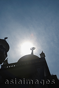 Asia Images Group - Top of mosque with skyline and sun background