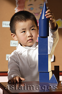 Asia Images Group - Schoolboy with building blocks