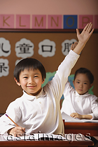 Asia Images Group - Students in class raising hands