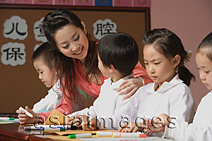 Asia Images Group - Young school children with their teacher