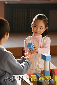Asia Images Group - Young children playing with building blocks