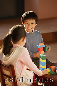 Asia Images Group - Young children playing with building blocks
