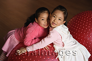 Asia Images Group - Two girls smiling at camera