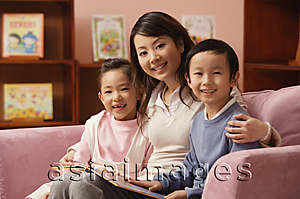 Asia Images Group - Mother with son and daughter at home