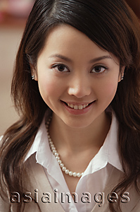 Asia Images Group - Young woman smiling at camera