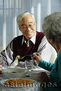 Asia Images Group - Elderly couple at dinner table