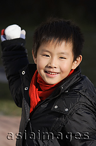 Asia Images Group - Young boy about to throw snowball