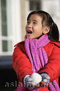 Asia Images Group - Young girl with snowball
